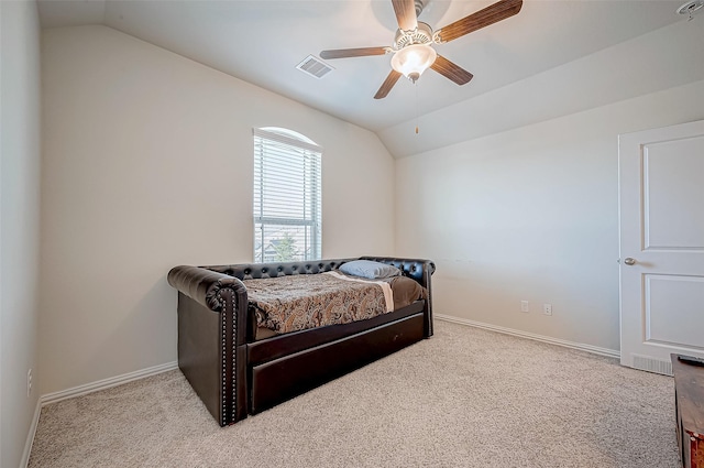 carpeted bedroom featuring ceiling fan and vaulted ceiling