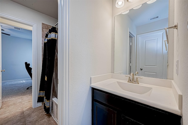 bathroom with tile patterned floors, vanity, and shower / bath combination with curtain