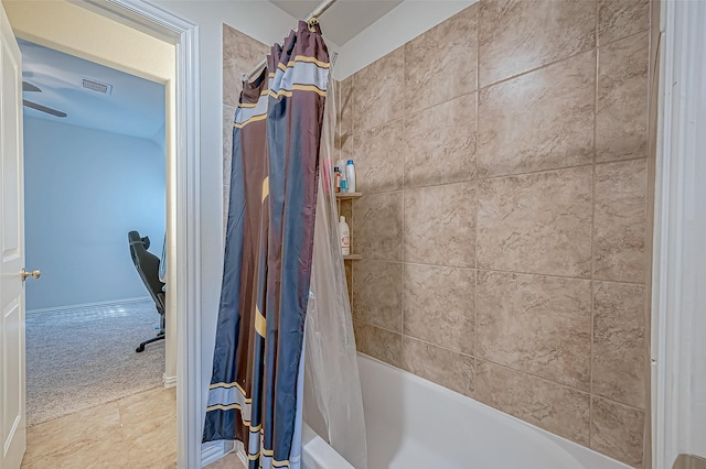 bathroom with tile patterned floors and shower / tub combo with curtain