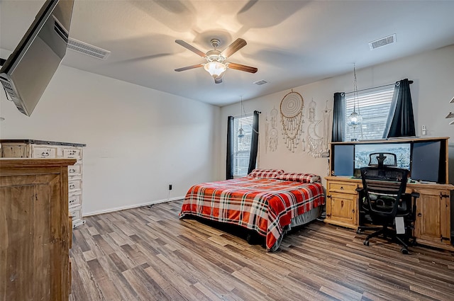 bedroom featuring ceiling fan and wood-type flooring