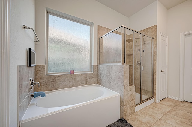 bathroom with separate shower and tub