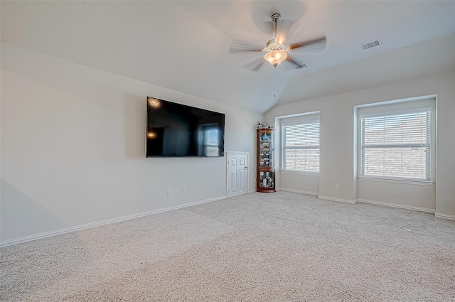 unfurnished living room featuring carpet flooring, ceiling fan, and lofted ceiling