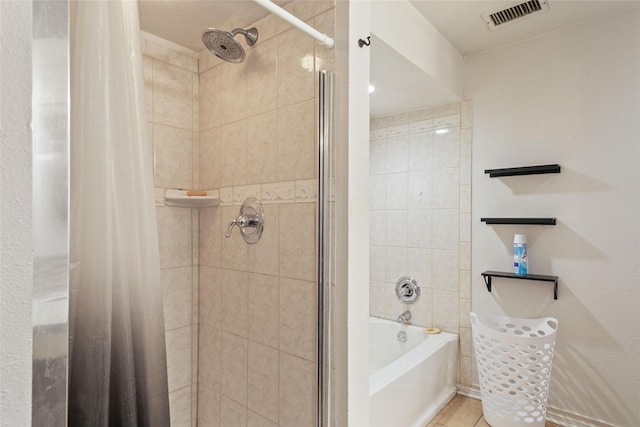 bathroom with shower / tub combo and tile patterned floors