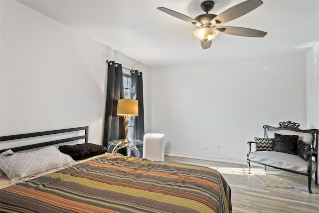 bedroom featuring light hardwood / wood-style flooring and ceiling fan