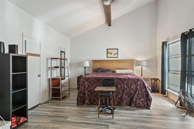 bedroom with beamed ceiling, hardwood / wood-style floors, high vaulted ceiling, and ceiling fan