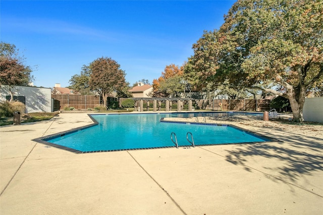 view of swimming pool with a patio area