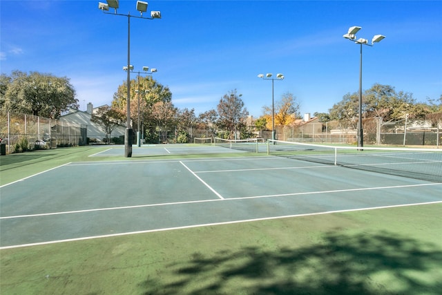 view of tennis court featuring basketball court