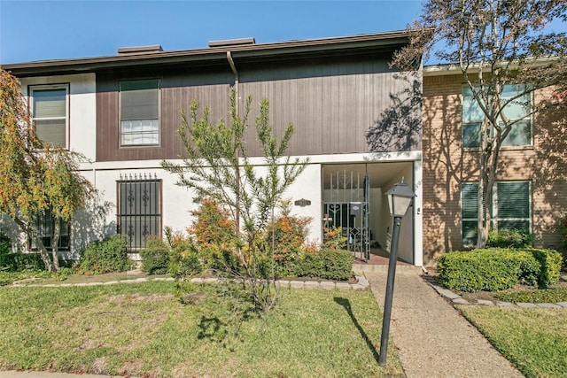 exterior space with a front lawn