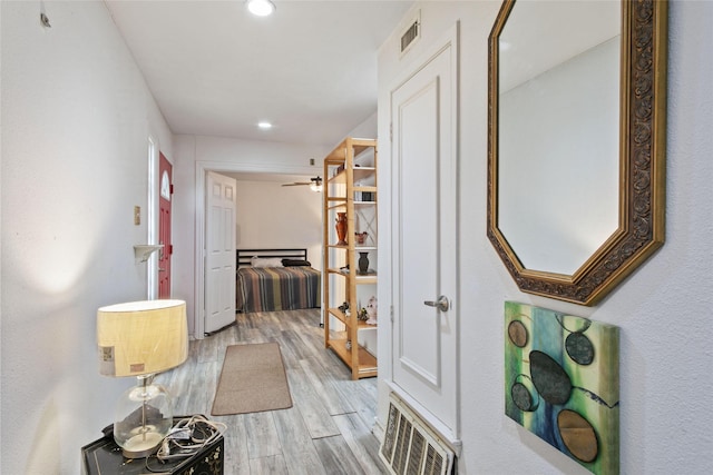 hallway featuring light wood-type flooring