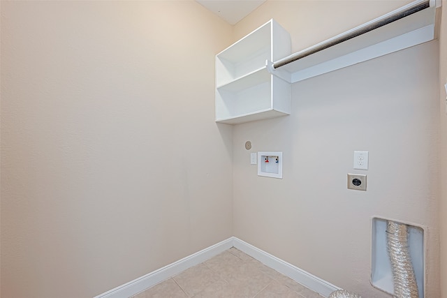 washroom with electric dryer hookup, hookup for a gas dryer, light tile patterned floors, and washer hookup