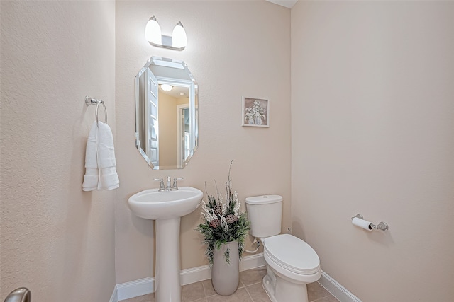 bathroom featuring tile patterned floors and toilet