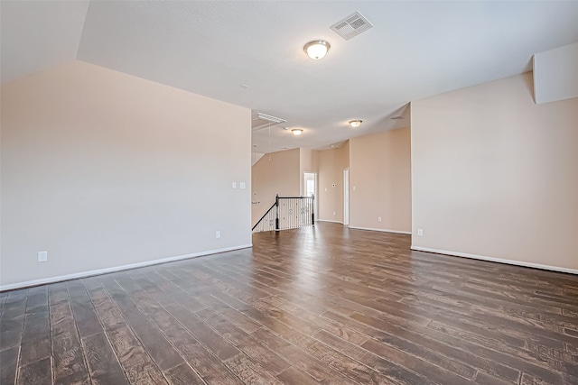 unfurnished room with dark hardwood / wood-style floors