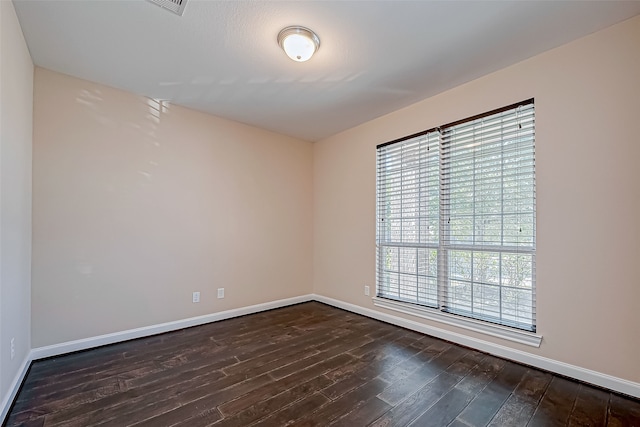 unfurnished room featuring dark hardwood / wood-style floors