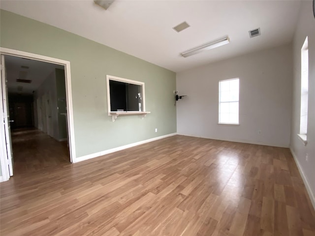 spare room featuring light hardwood / wood-style flooring