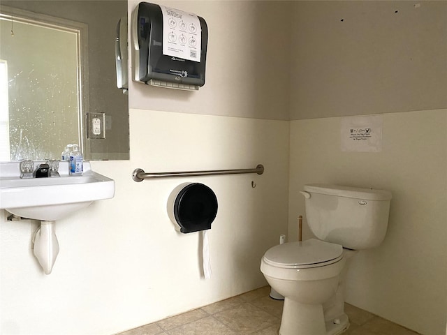 bathroom featuring tile patterned floors and toilet