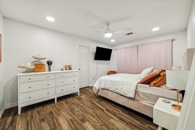 bedroom with ceiling fan and dark hardwood / wood-style flooring