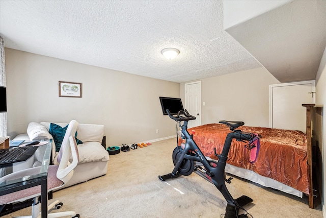 carpeted bedroom featuring a textured ceiling