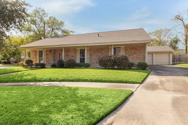 single story home featuring a garage and a front lawn