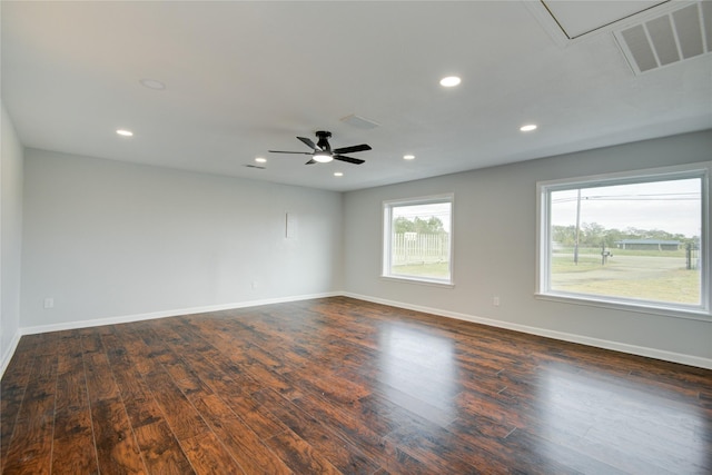 spare room with ceiling fan and dark hardwood / wood-style floors