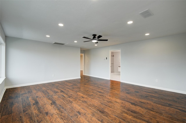 unfurnished room featuring ceiling fan and dark wood-type flooring