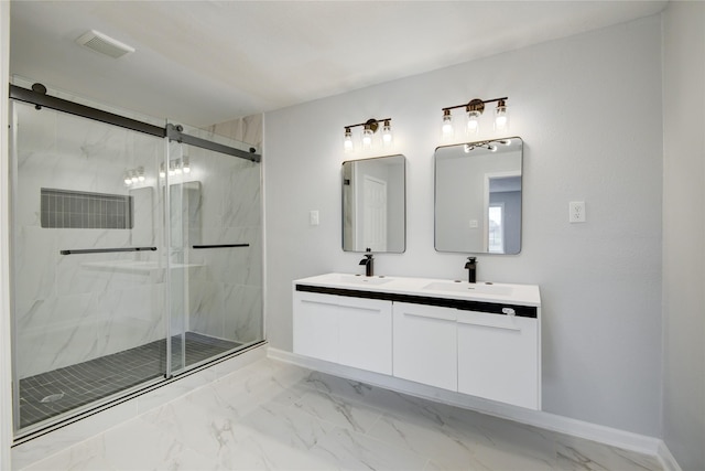 bathroom with a shower with door and vanity