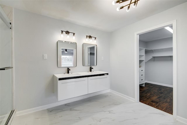 bathroom featuring vanity, wood-type flooring, and a shower with shower door