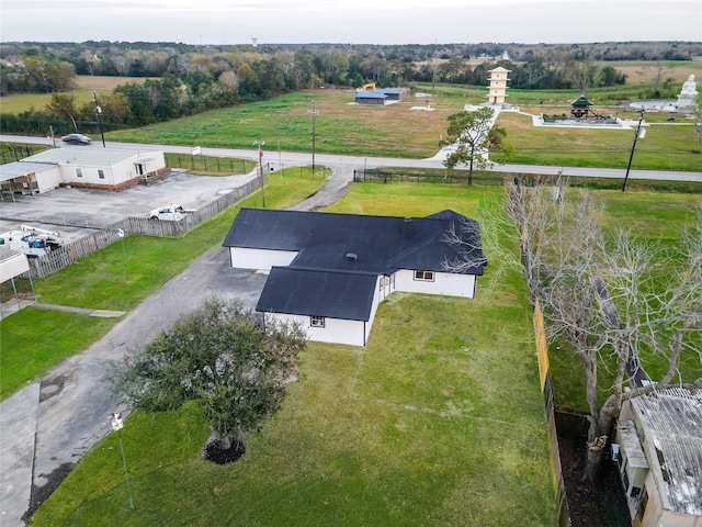 birds eye view of property with a rural view