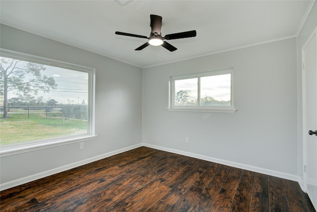 spare room with dark hardwood / wood-style floors, ceiling fan, and ornamental molding