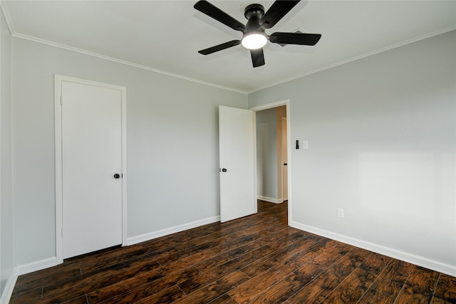 unfurnished bedroom featuring dark hardwood / wood-style flooring, ceiling fan, and ornamental molding