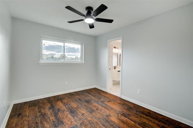 unfurnished room featuring dark hardwood / wood-style floors and ceiling fan