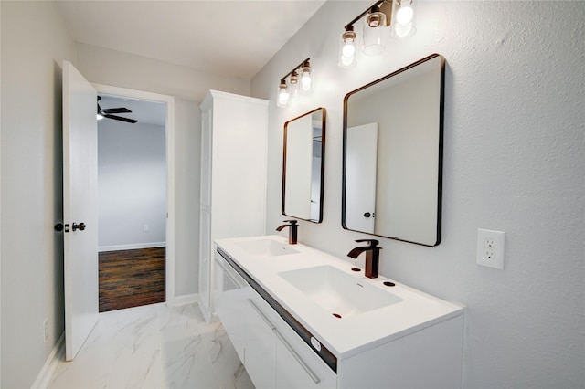 bathroom with ceiling fan, vanity, and hardwood / wood-style flooring