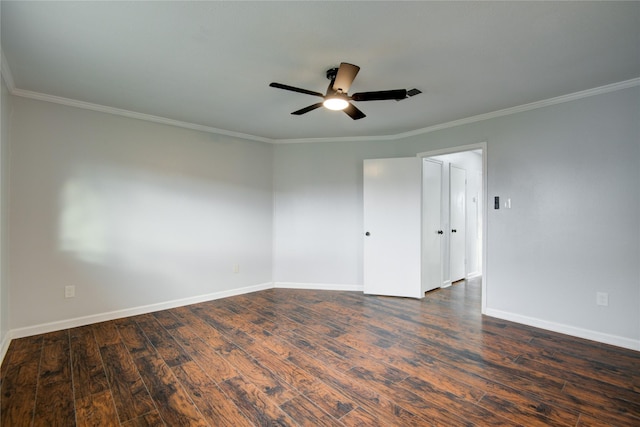 unfurnished room with crown molding, ceiling fan, and dark wood-type flooring