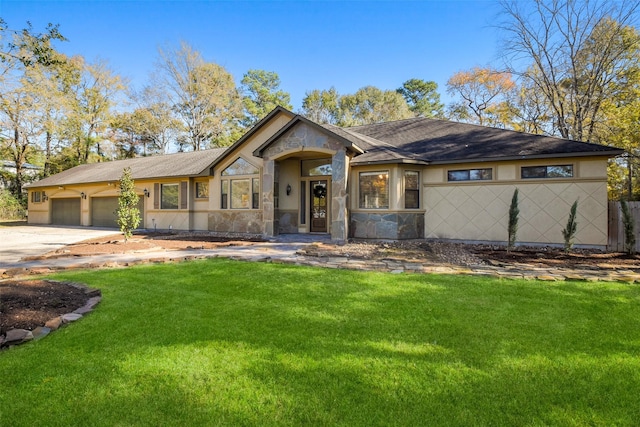 view of front facade with a front yard and a garage