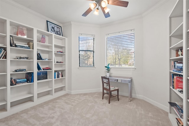 office space featuring ceiling fan, light colored carpet, and crown molding