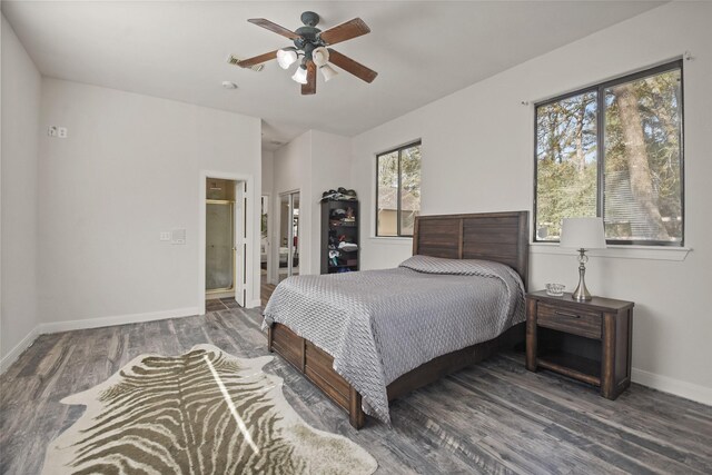 bedroom with multiple windows, ceiling fan, and dark hardwood / wood-style floors