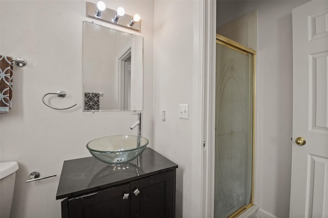 bathroom featuring vanity and a shower with shower door