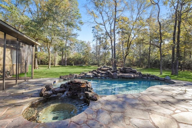 view of swimming pool featuring a patio area and a lawn