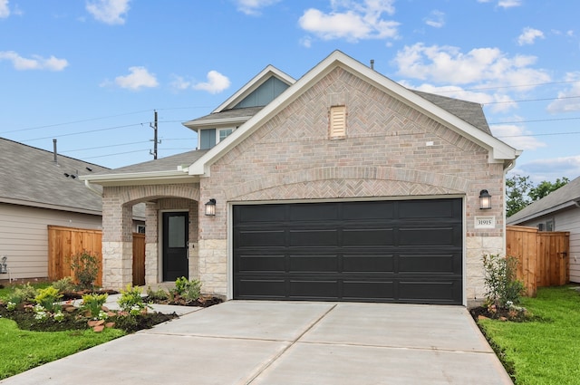 31915 Splendor Dr, Fulshear, TX 77441 - view of front of property featuring concrete driveway, an attached garage, brick siding, roof with shingles, and stone siding