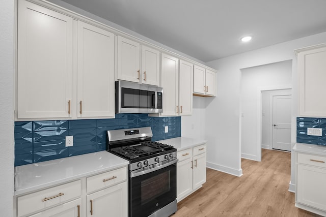 31915 Splendor Dr, Fulshear, TX 77441 - kitchen featuring stainless steel appliances, backsplash, light countertops, and recessed lighting