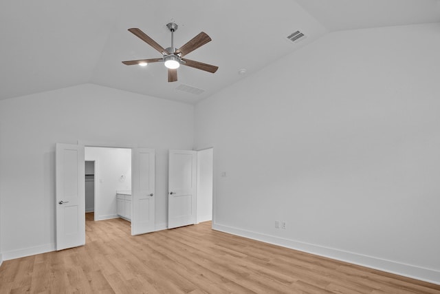 31915 Splendor Dr, Fulshear, TX 77441 - unfurnished bedroom featuring light wood-style flooring, baseboards, a ceiling fan, high vaulted ceiling, and a walk in closet