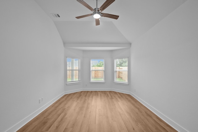 31915 Splendor Dr, Fulshear, TX 77441 - empty room featuring light wood-style flooring, ceiling fan, healthy amount of natural light, lofted ceiling, and baseboards