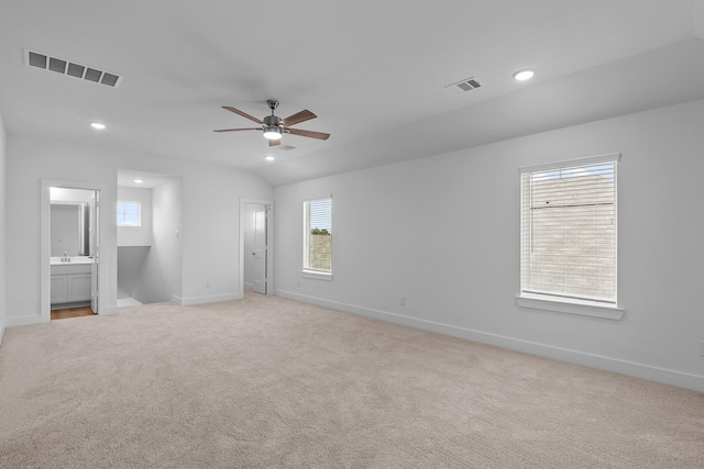 31915 Splendor Dr, Fulshear, TX 77441 - unfurnished bedroom with multiple windows, baseboards, light carpet, ensuite bath, and recessed lighting