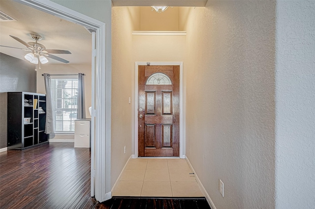 entryway with light hardwood / wood-style flooring and ceiling fan