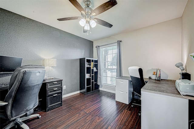 office space featuring ceiling fan and dark wood-type flooring