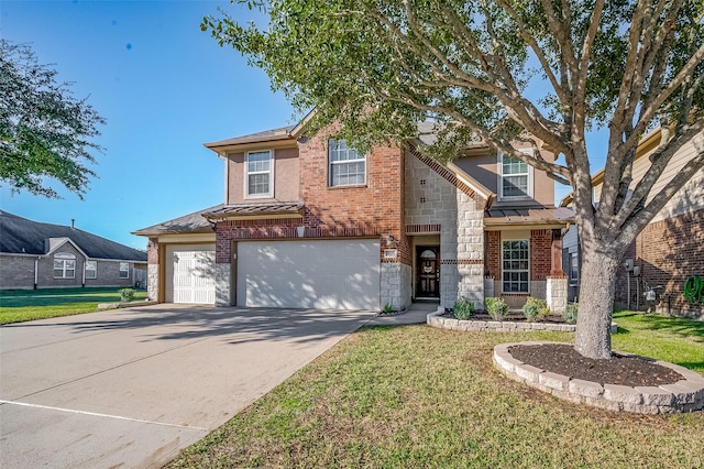 view of front of home with a garage and a front lawn