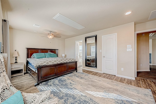 bedroom featuring ceiling fan and light hardwood / wood-style flooring