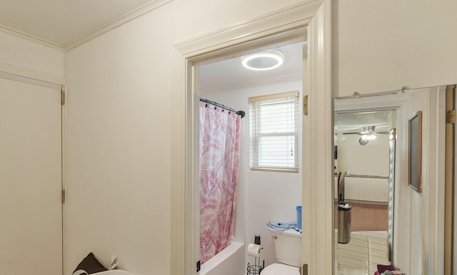 full bathroom with ceiling fan, ornamental molding, toilet, and shower / bathtub combination with curtain