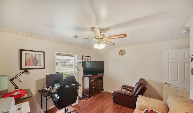 living area featuring ornamental molding, a ceiling fan, and wood finished floors