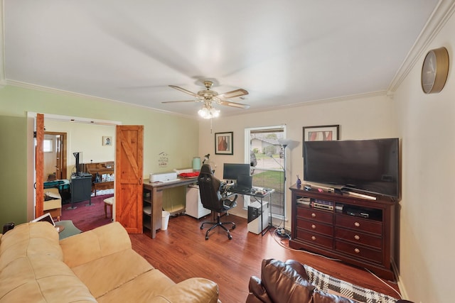 home office featuring crown molding, a ceiling fan, and wood finished floors