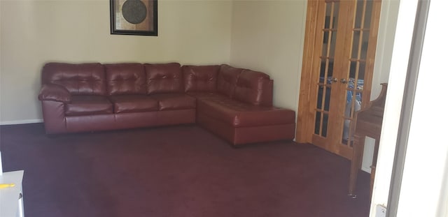 carpeted living area with french doors